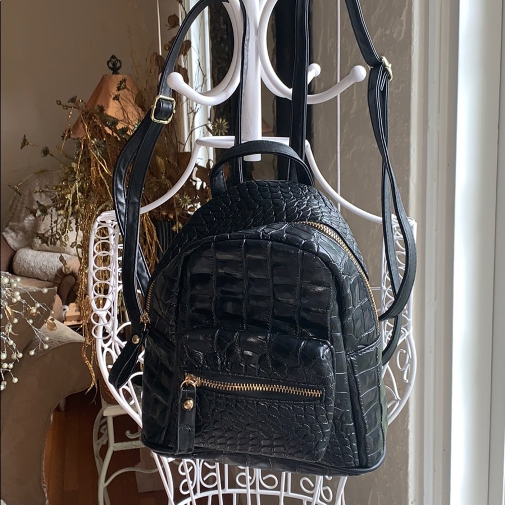 Black faux crocodile skin backpack from Nasty Gal